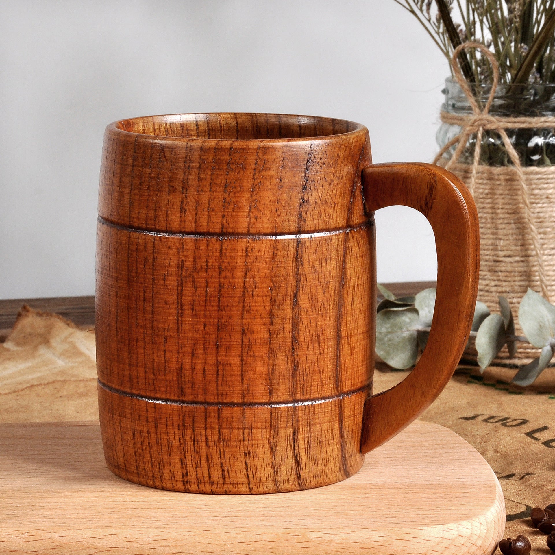 Wooden mug on a wooden surface with a neutral background