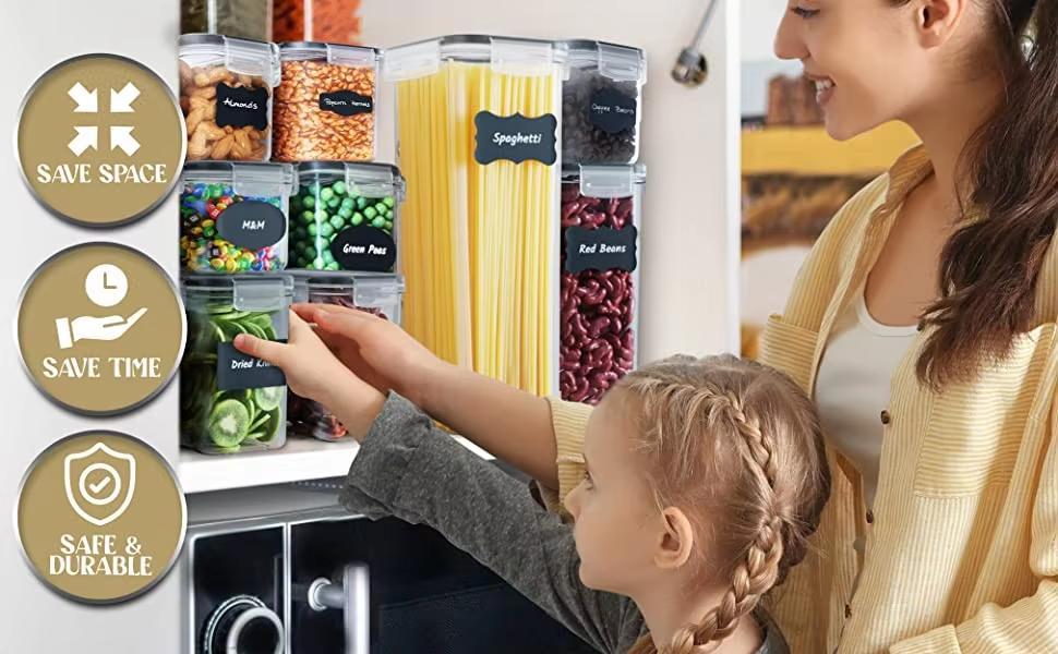 Woman and child interacting with kitchen storage containers labeled with food names.