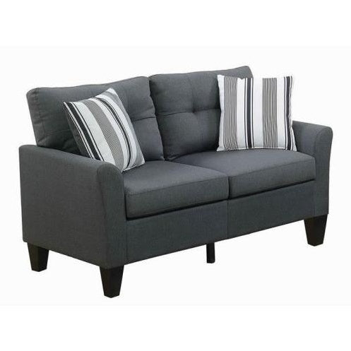 Gray sofa with striped cushions on a white background