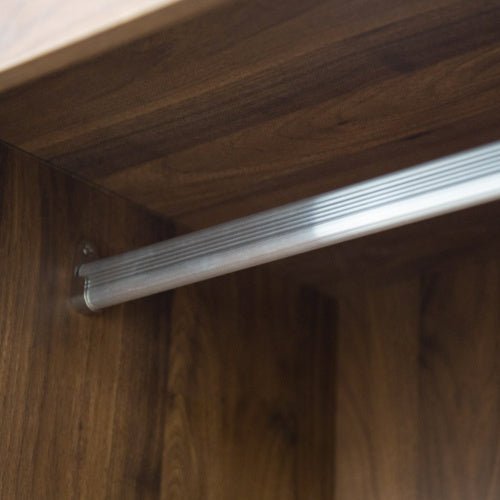 Metal handle on a wooden cabinet