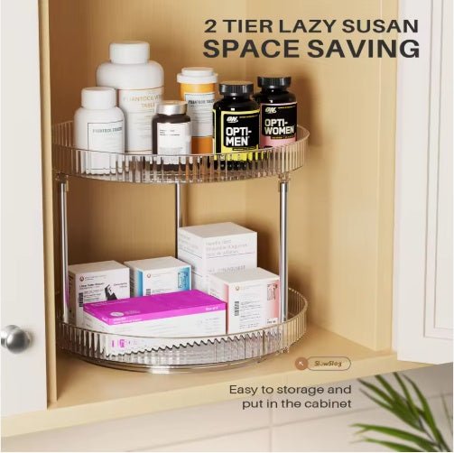 Two-tier lazy susan organizer with health and wellness products inside a cabinet.