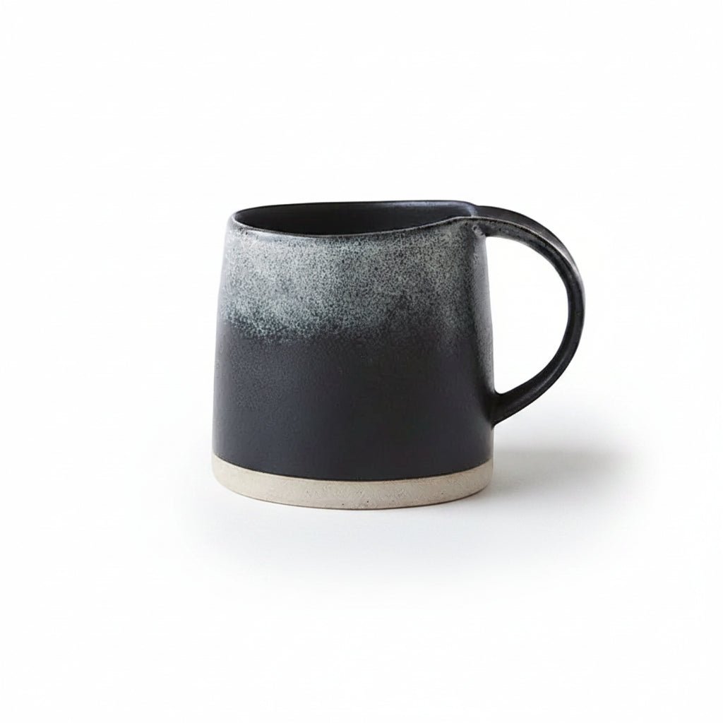 Black ceramic mug on a white background