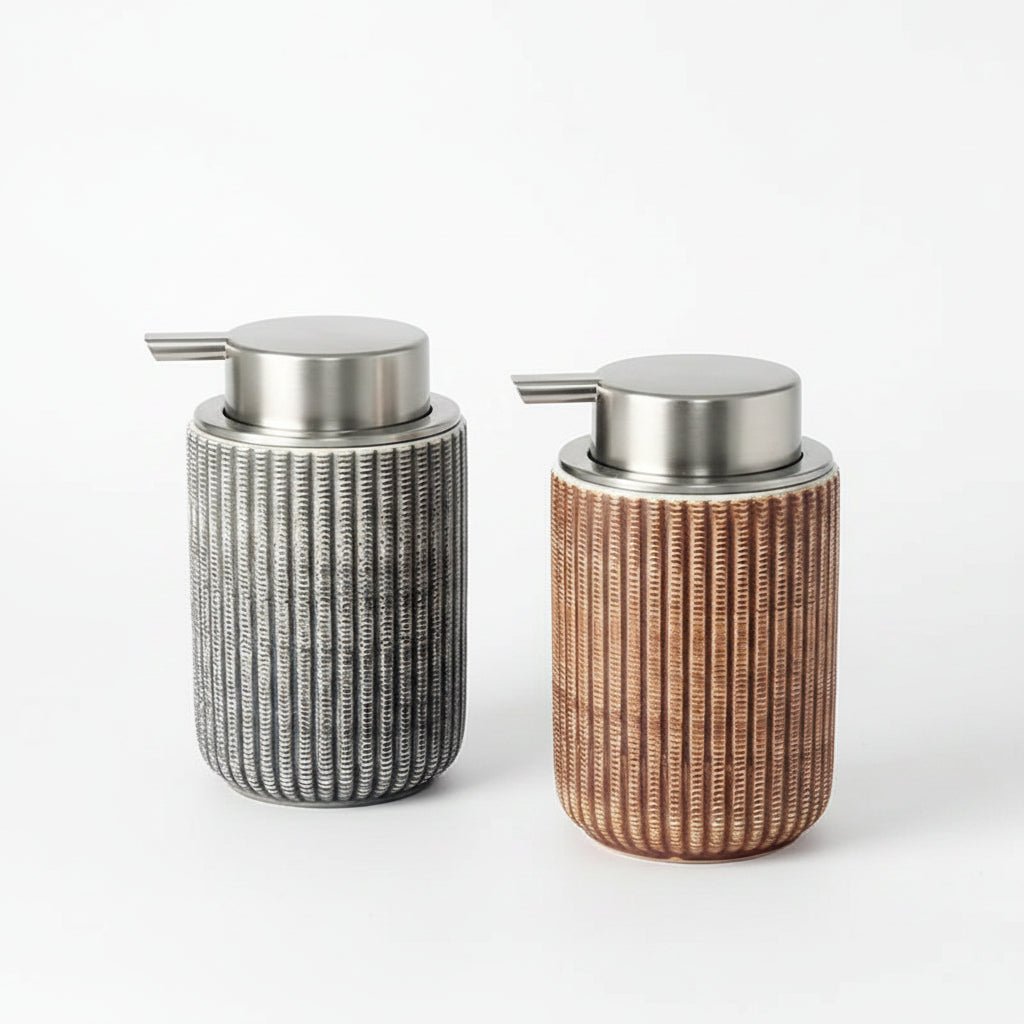 Two decorative bottles with wicker-like texture and metallic caps on a gray surface.