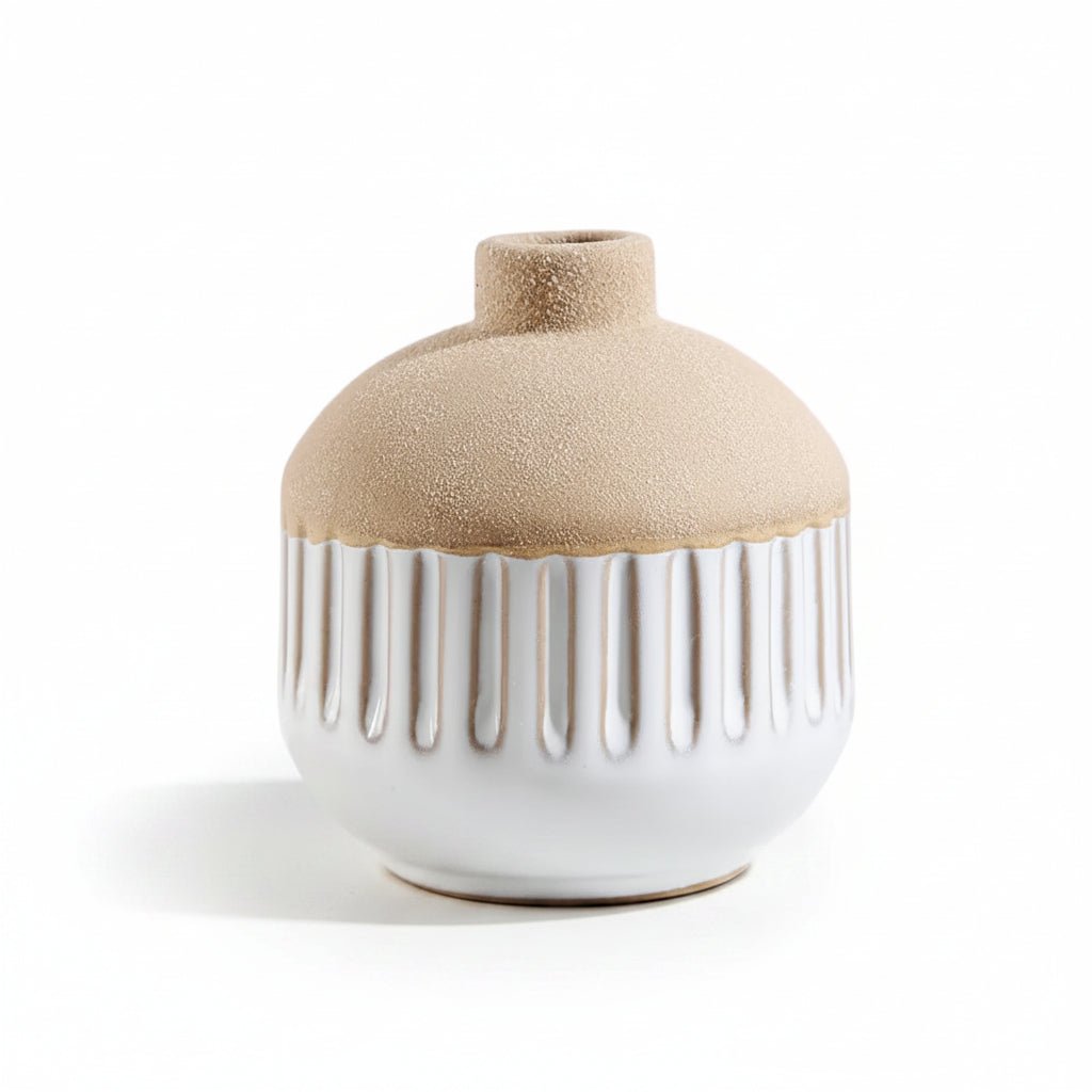 A ceramic bud vase with a textured beige top and a glossy white ribbed base, photographed on a clean white background.