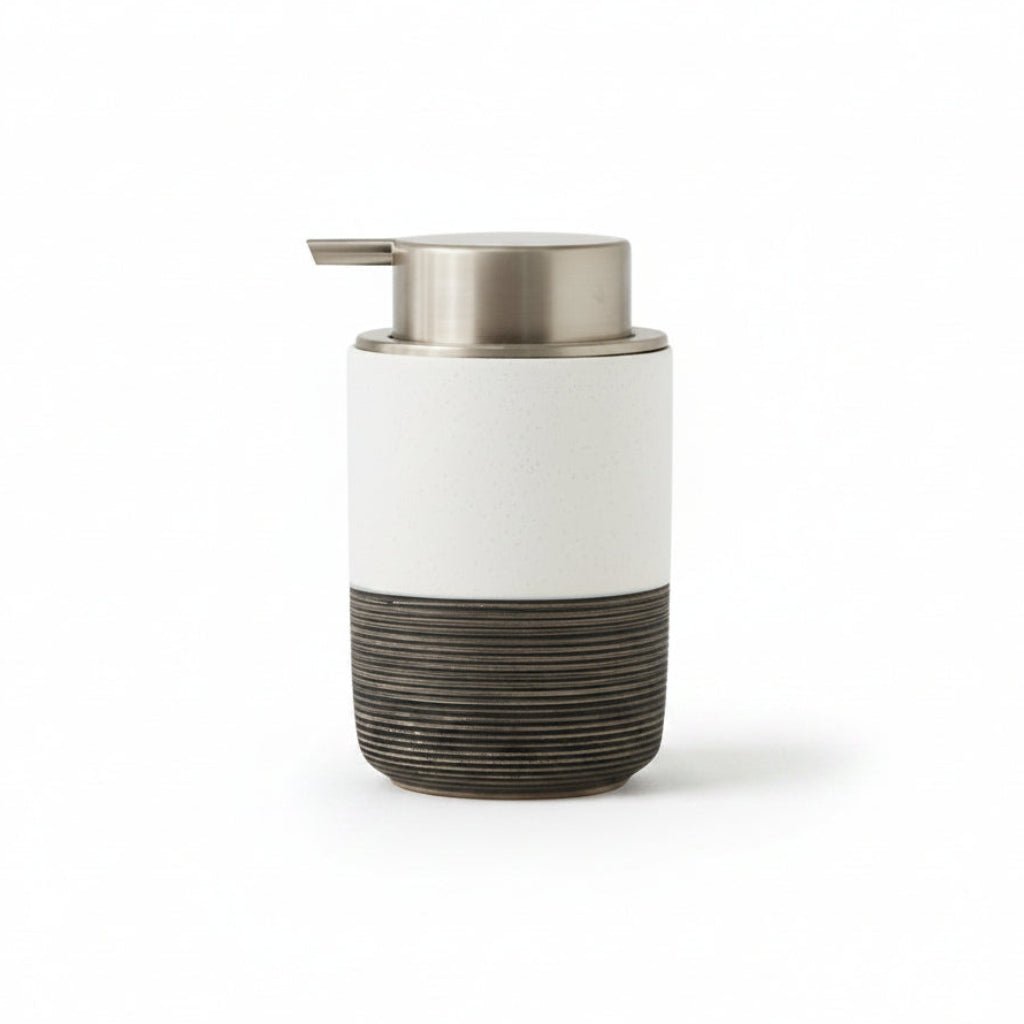 White and black soap dispenser with dimensions on a white background