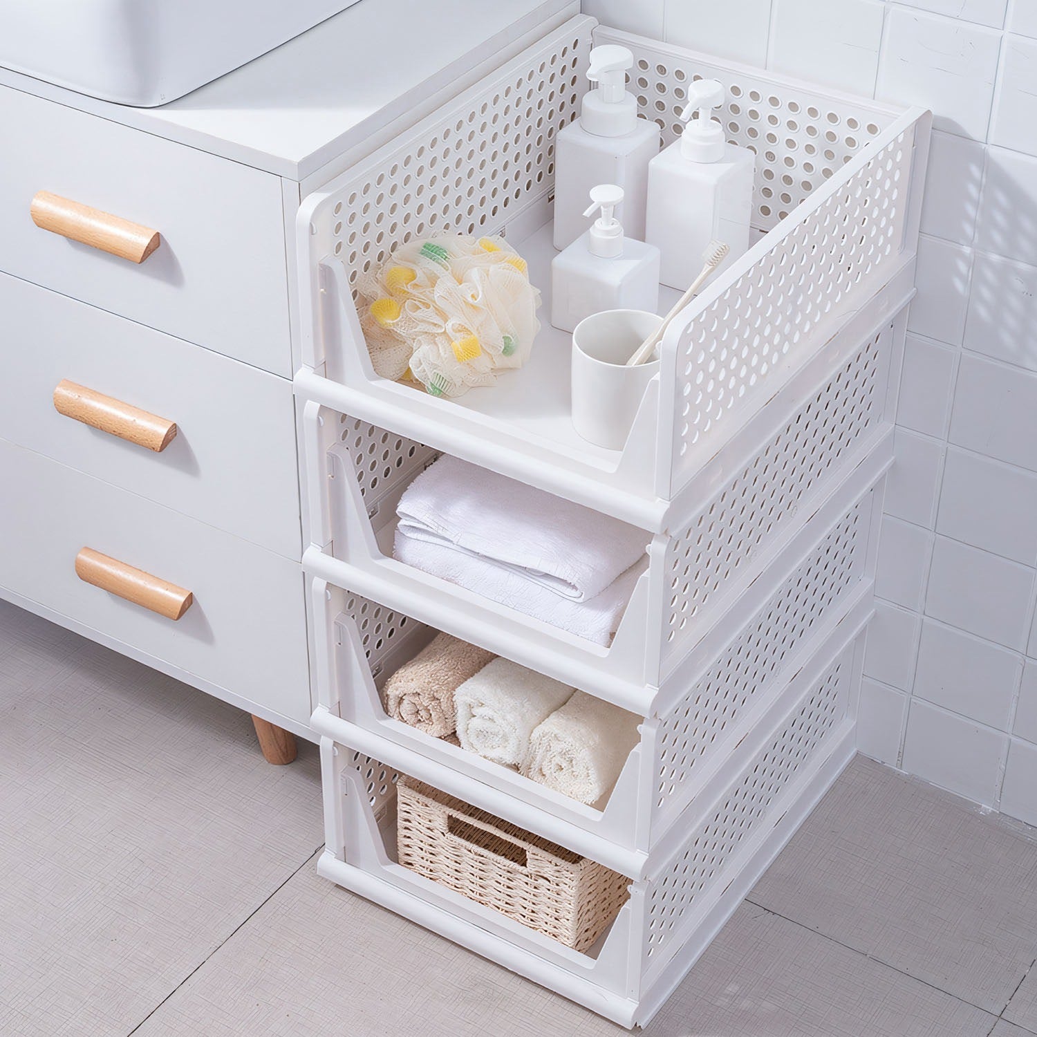 White woven storage basket with shelves in a bathroom setting.