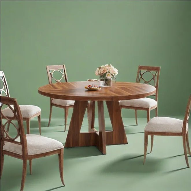 Wooden dining table with chairs on a green background