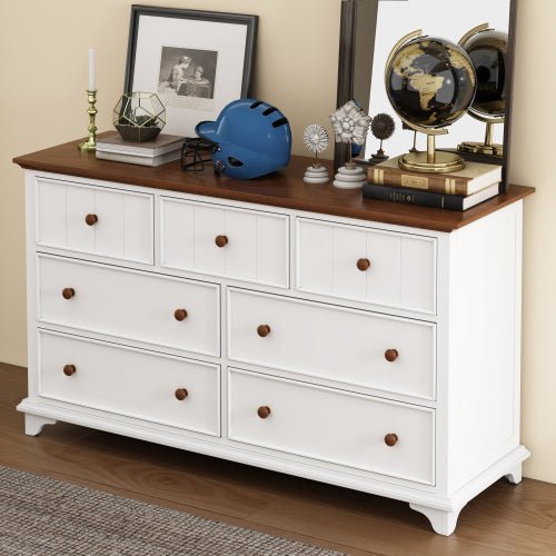 White dresser with wooden top in a room setting