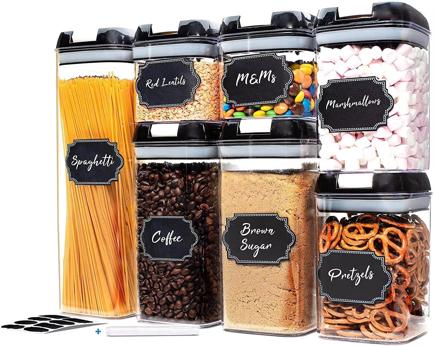 Set of clear containers with snacks and labels on a white background