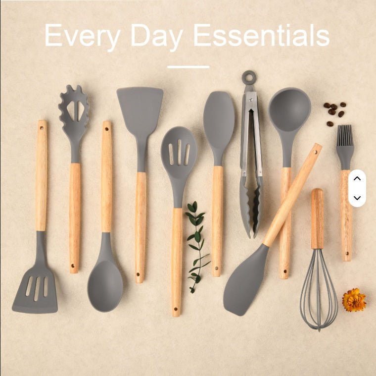 Set of kitchen utensils with gray utensils and wooden handles on a beige background.