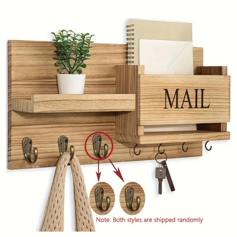 Wooden wall organizer with shelves, hooks, and a 'MAIL' box on a white background.