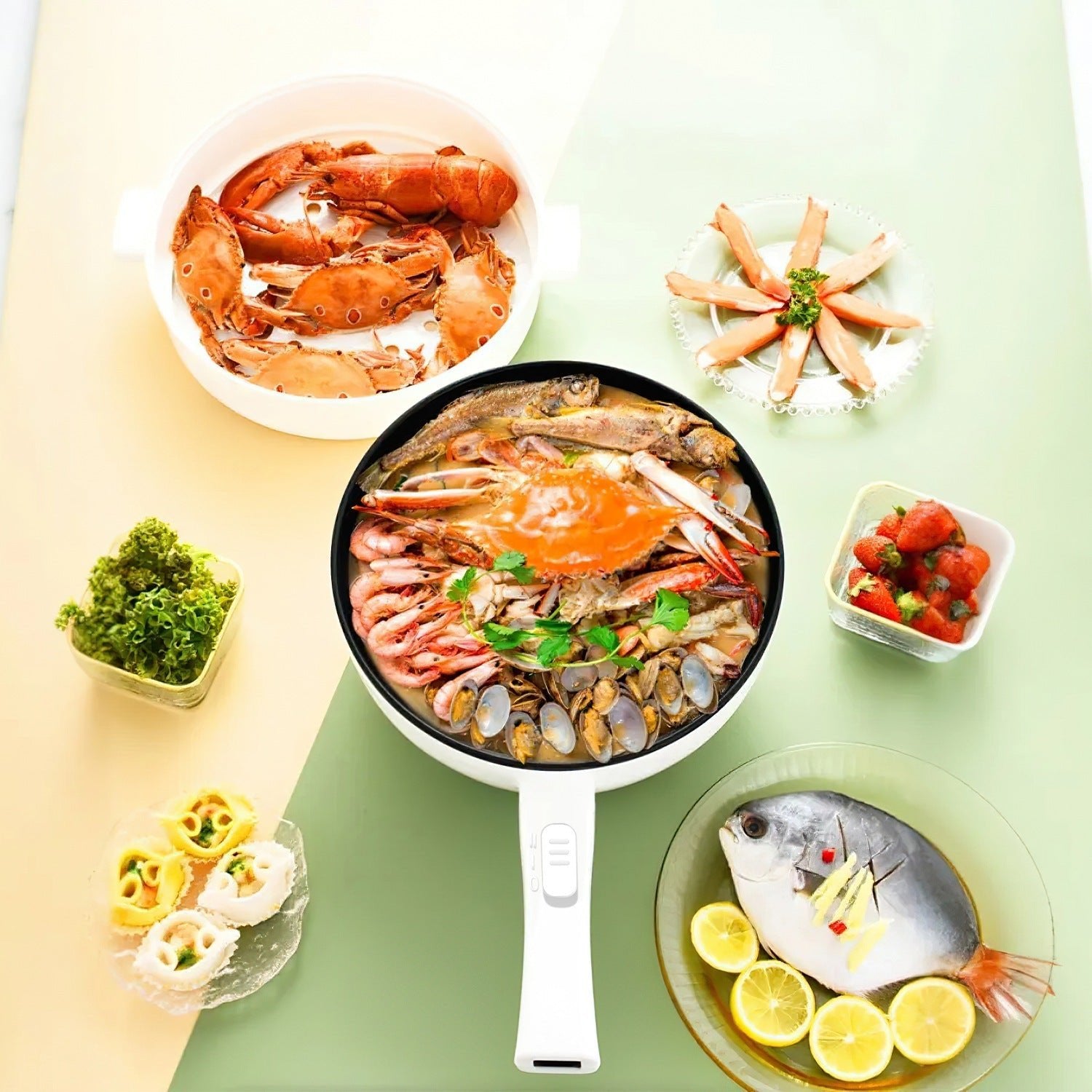 Seafood dish with a pan of seafood on a green table