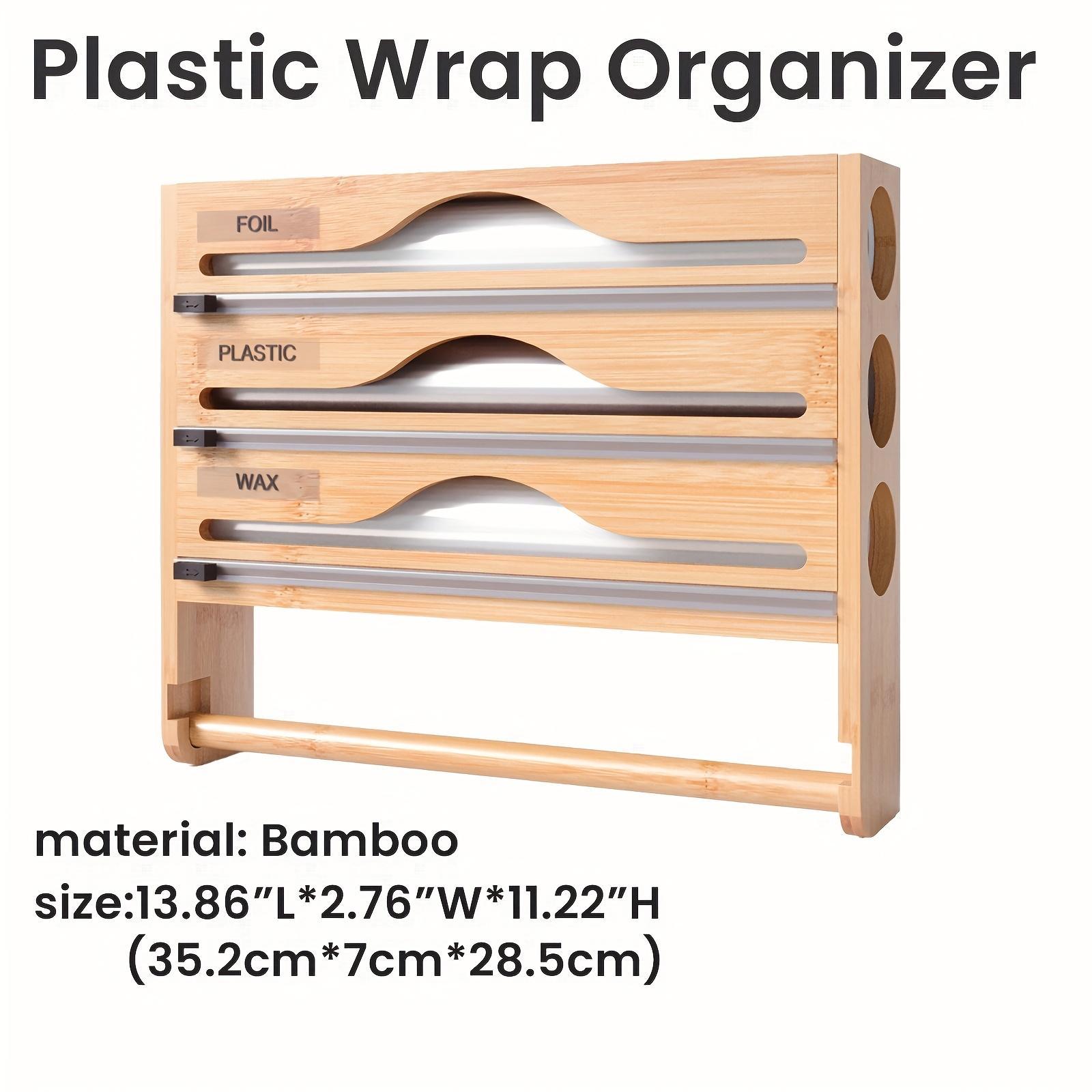 Wooden plastic wrap organizer with labeled slots on a white background