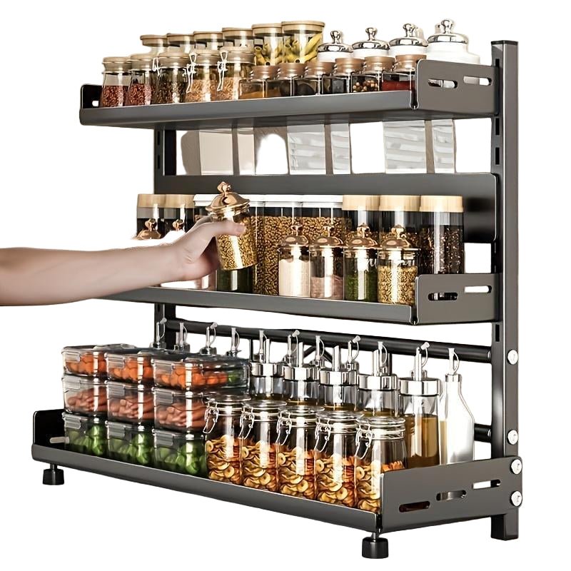 Spice rack with various jars of spices on a kitchen counter.