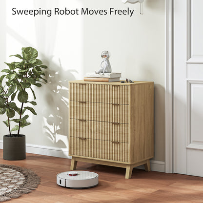 Robotic vacuum cleaner on a wooden floor next to a cabinet with a plant and decorative items.