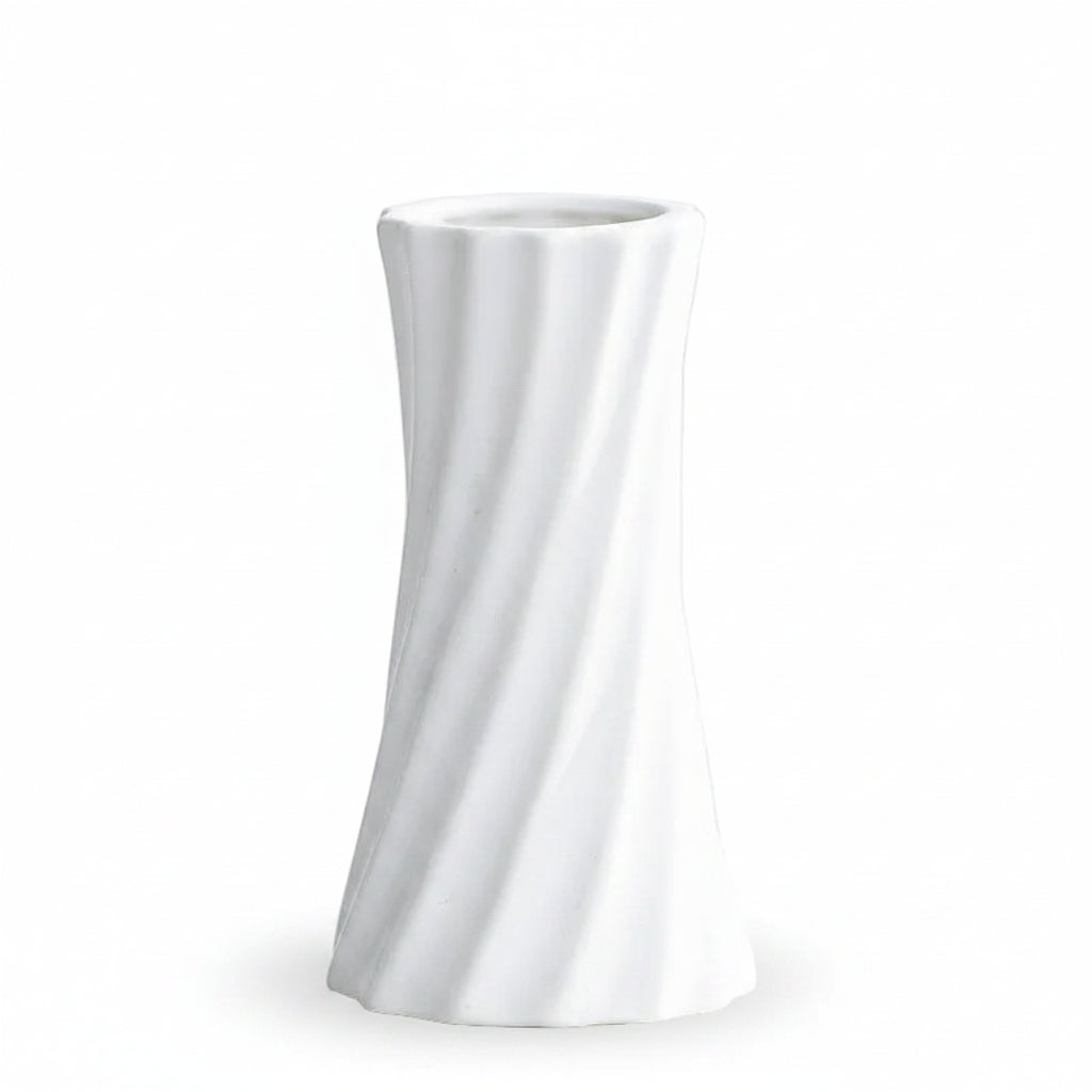 A white ceramic vase with a twisted, fluted design, shown on a light gray surface with text overlay detailing its dimensions.
