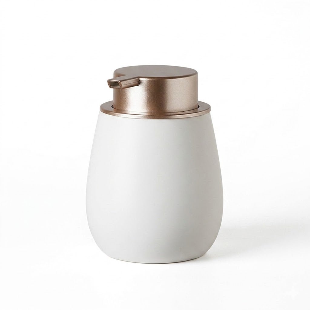 White soap dispenser with bronze pump on a white background