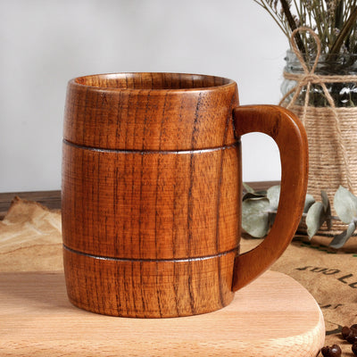 Wooden mug on a wooden surface with a neutral background