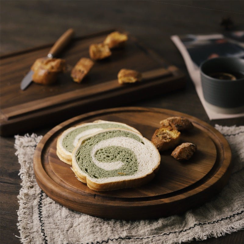 Black Walnut Wood Cutting Board used as a serving tray with bread and snacks, showcasing its stylish and durable design.