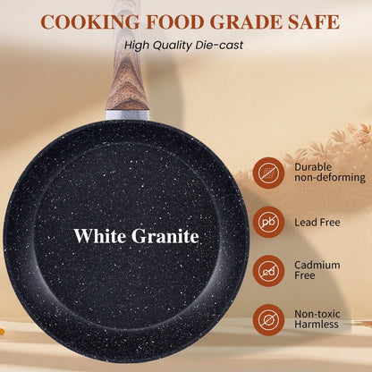 Black speckled frying pan with wooden handle on a beige background, featuring 'White Granite' branding.