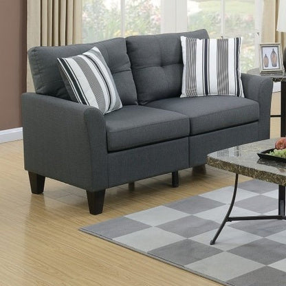 Gray sofa with striped cushions in a living room setting