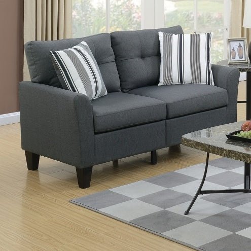 Gray sofa with striped cushions in a living room setting