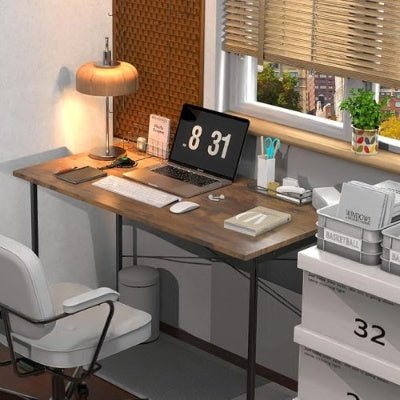 Home office setup with a desk, chair, and computer equipment.