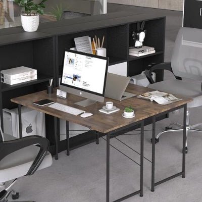 Modern office desk with computer setup, chairs, and decor in a room.
