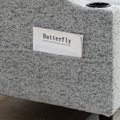 Textured gray box with a 'Butterfly' label on a wooden floor.