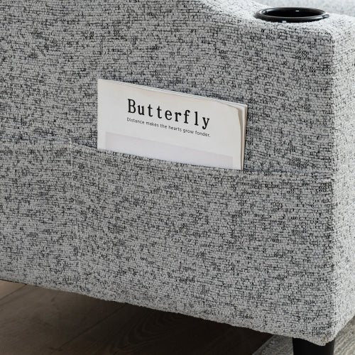 Textured gray box with a 'Butterfly' label on a wooden floor.