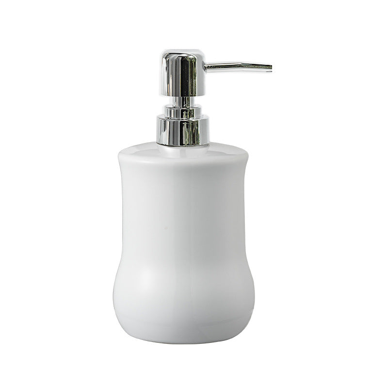 White soap dispenser with silver pump on a white background