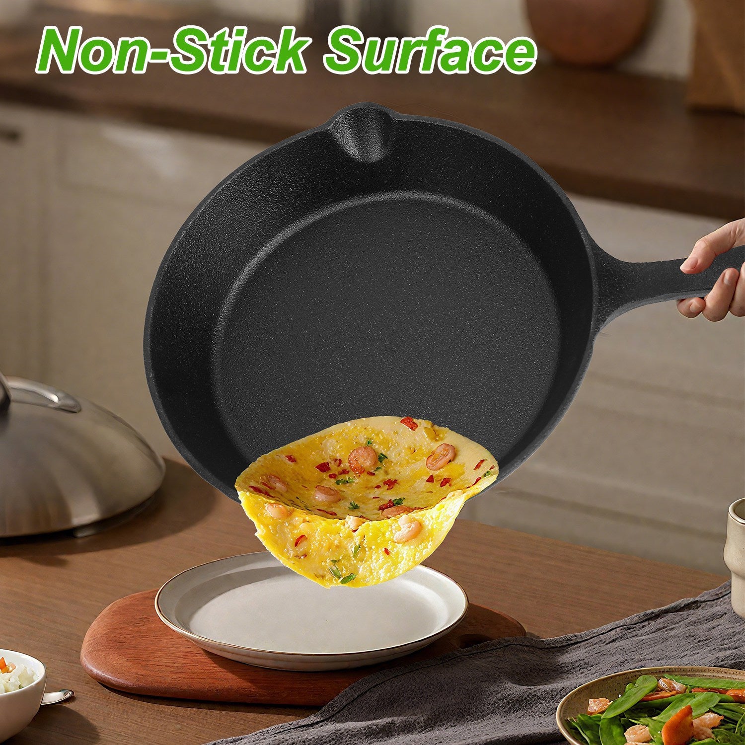 Black cast iron skillet with a cooked omelette on a wooden surface
