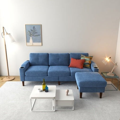 Blue sofa in a living room with a coffee table and decorative items.
