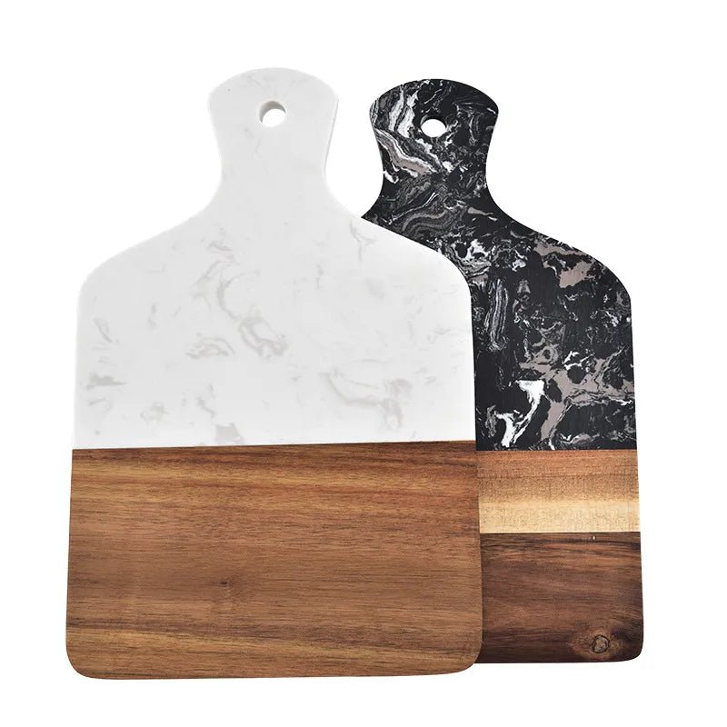 Two marble and wood cutting boards on a white background