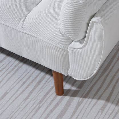 White sofa with wooden legs on a striped carpet