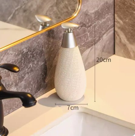 Beige textured vase on a bathroom counter with measurements indicated