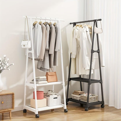 Two clothing racks with clothes and shelves against a white wall.