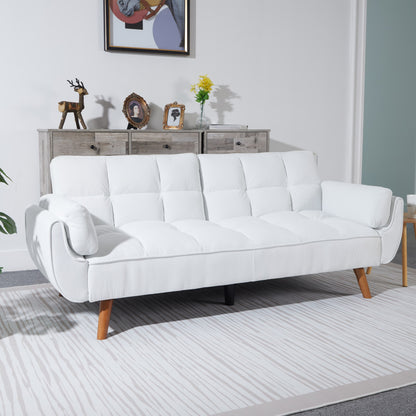 White sofa in a living room setting with a neutral color palette