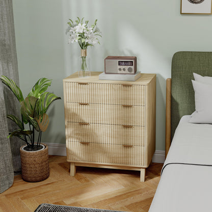 Wooden dresser with a radio and flowers in a room with a bed and plant.