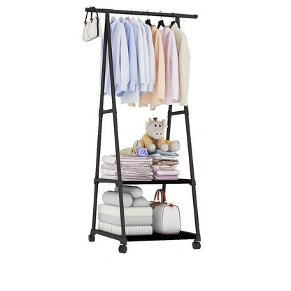 Black clothing rack with clothes, bags, and a teddy bear on a white background