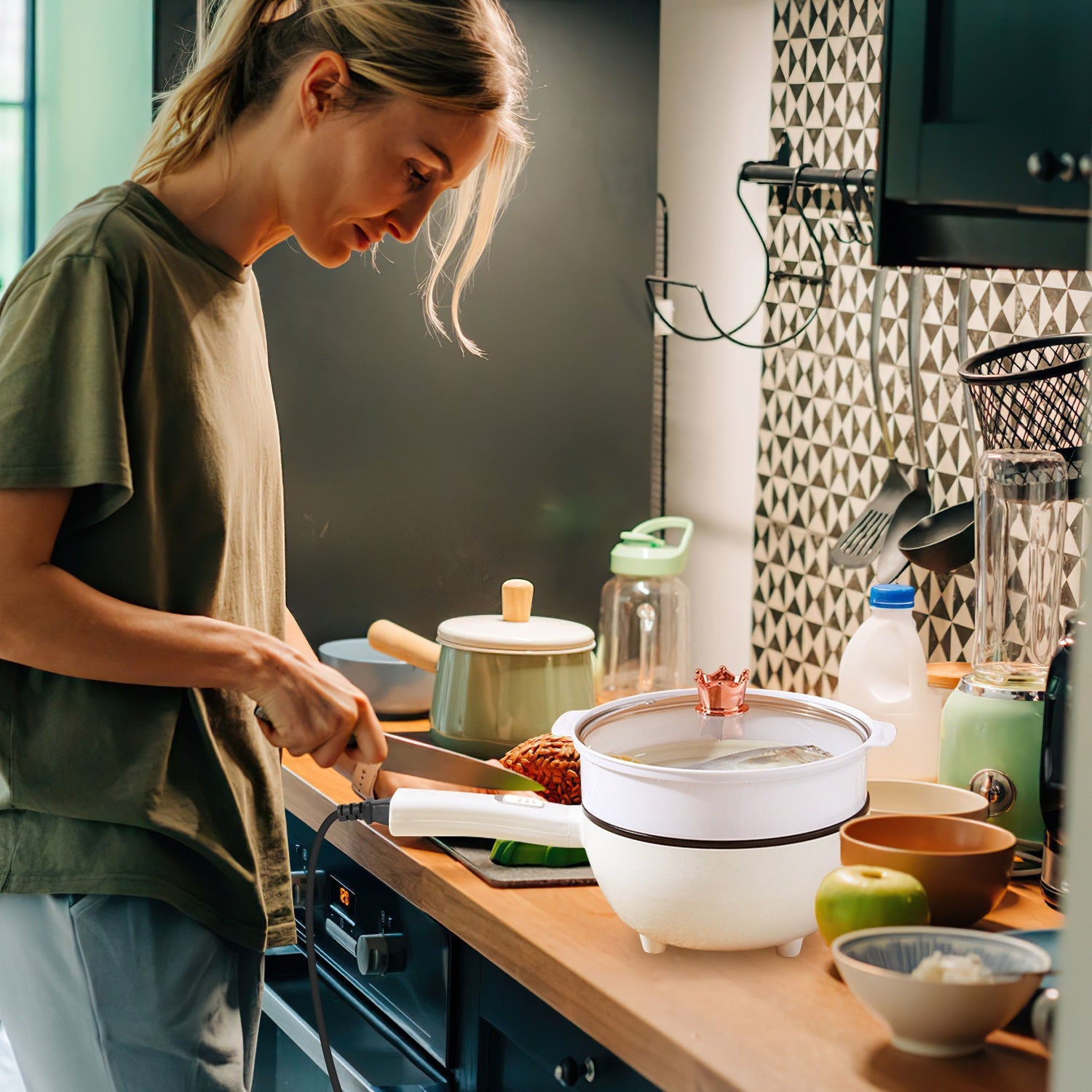 Woman cooking in a kitchen with various utensils and appliances.