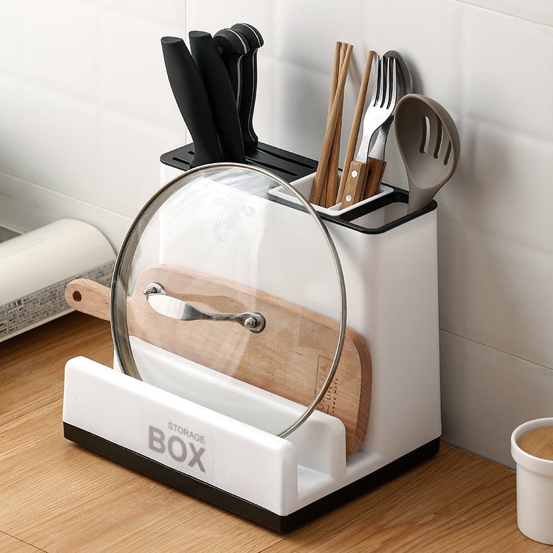 Plastic knife storage rack with slots, compact design, organized kitchen solution.