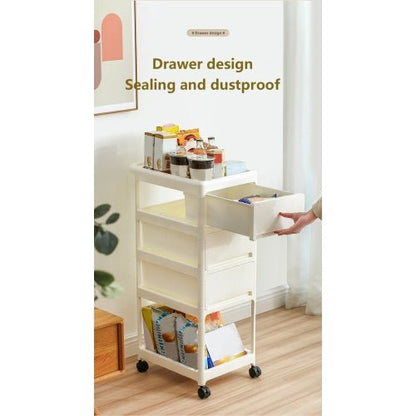 White rolling cart with drawers on wheels in a room setting.