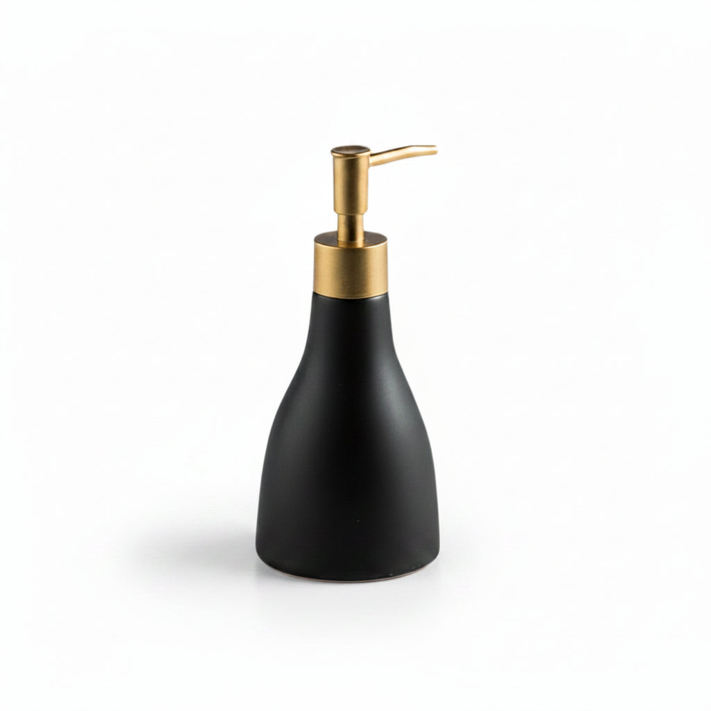 Black soap dispenser with gold pump on a white background