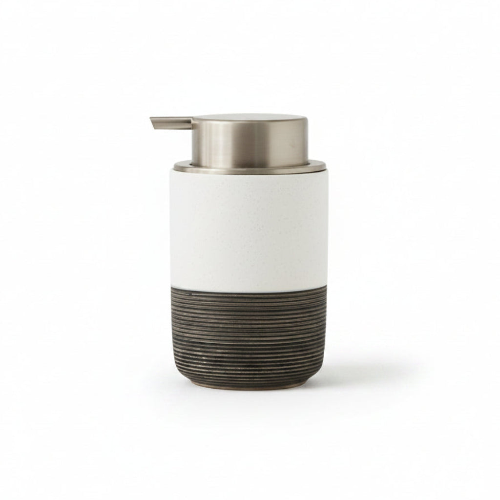 White and black soap dispenser with dimensions on a white background