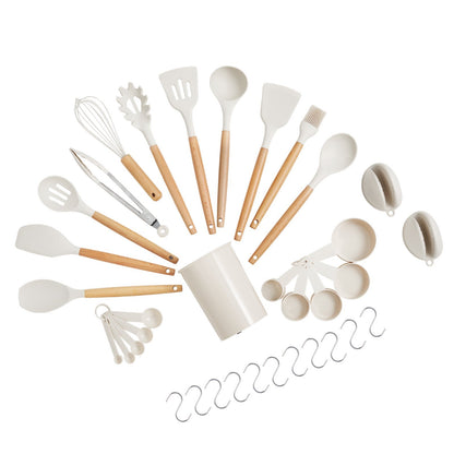 Set of kitchen utensils with wooden handles on a white background