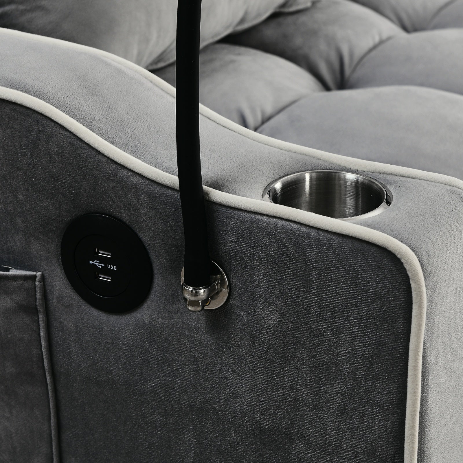Gray upholstered chair with cup holder and USB charging port
