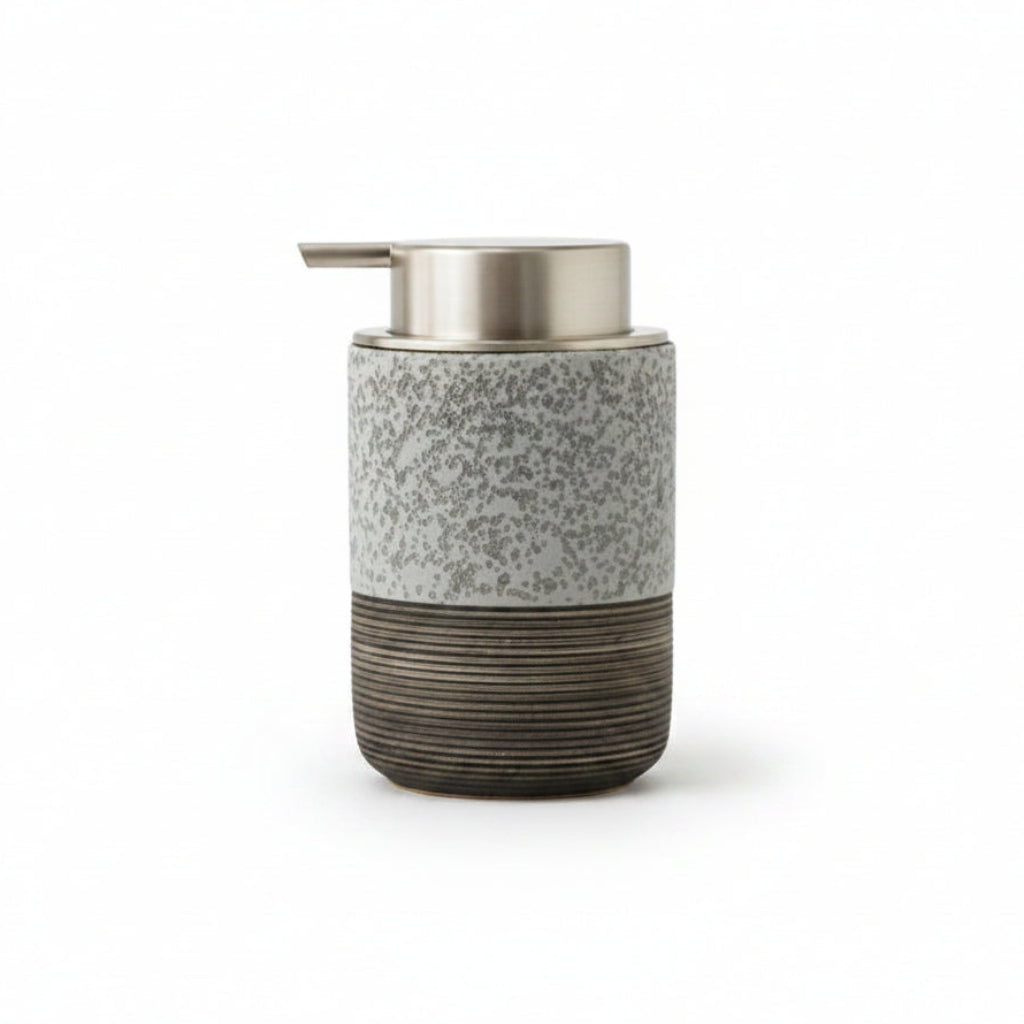 A cylindrical soap dispenser with a speckled gray upper body, a brushed metallic silver pump, and a dark ribbed lower section, shown with dimension labels indicating 8 cm width and 13.5 cm height on a white background.