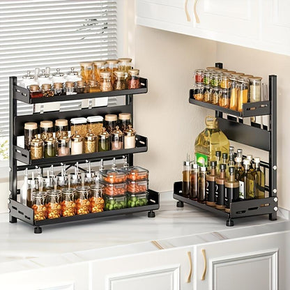 Black tiered spice racks filled with jars on a kitchen counter.