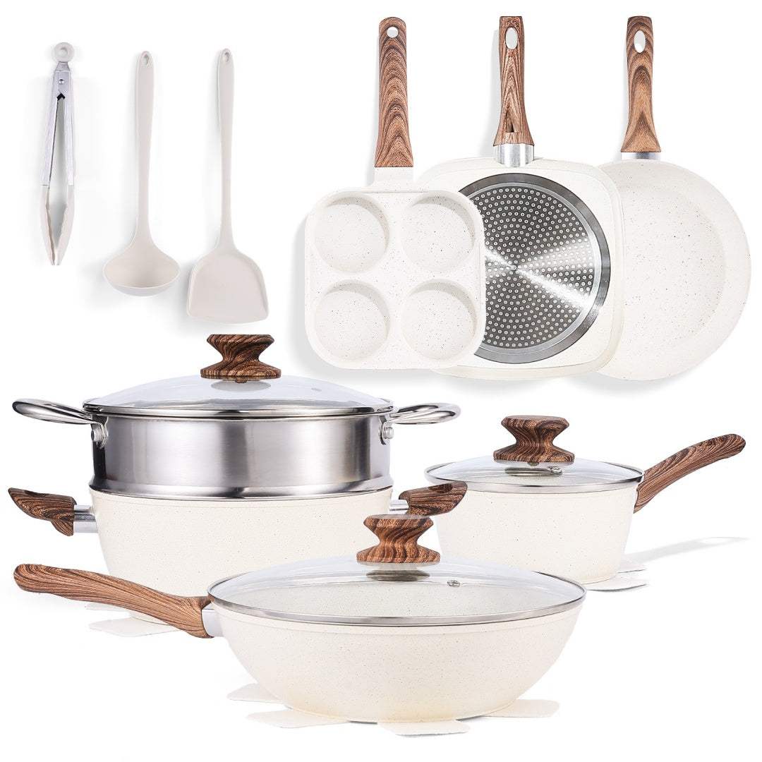 Set of cookware with wooden handles on a white background